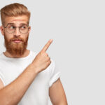 horizontal shot attractive caucasian male has ginger hair beard points with fore finger aside dressed t shirt one colour with wall 150x150 - Aký je váš názor na dychovú hudbu ?